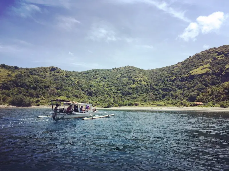 Sumbawa boat in the bay carrying tourists to the beach